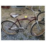 Burgundy huffy Santa Fe beach cruiser bicycle.