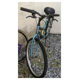 Teal Ladies Giant Boulder 520 Bicycle. Side Yard