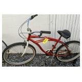 Orange Centrix Cruiser Bicycle. Side Yard