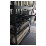 Metal shelf with steel stock and empty gun boxes