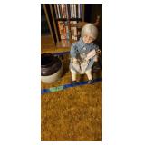 Doll with rocking chair and bean pot