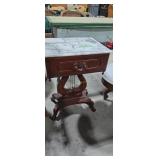 Violin base marble top table with drawer