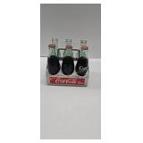Coca-Cola metal bottle carrier with glass bottles