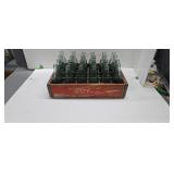 Vintage wooden Coca-Cola box with glass Coke