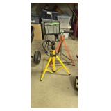 Halogen light and roller stand