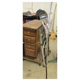 Wooden storage cabinet on wheels
