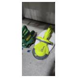 Weed eater blower and garden groom under table