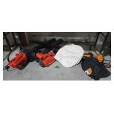 Lot of electric leaf blowers under table