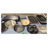 Lot of baking pans flat screen TV