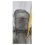 Four metal folding chairs