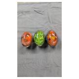 Three glass eggs with animal figures