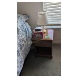one drawer nightstand with lamp telephone etc