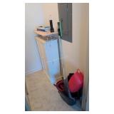 items in laundry room storage cabinet ironing