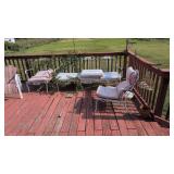 items on back deck table chairs barbecue grill etc