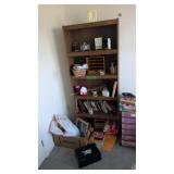 bookcase with books clock basket roll around