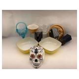 Assorted Household and Decorative Items Including Pyrex Bowls, Glassware, Skull Decor, and Mirror