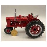 Red McCormick Farmall Model Tractor with Medal Ornament
