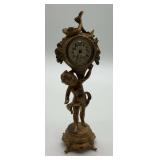 Cherub Holding Clock