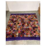 Colorful Patchwork Quilt with Tassels