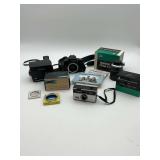 Polaroid Sun 640, Canon EOS Elan 100, Sawyers Pana-vue II, Ednalite Filter Set, & Tower 37A