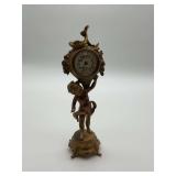 Cherub Holding Clock