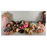 Thirteen Assorted Dolls with Accessories