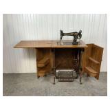 Antique Free Treadle Sewing Machine in Quarter Sawn Oak Cabinet