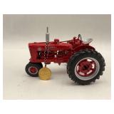 Red McCormick Farmall Model Tractor with Medal Ornament