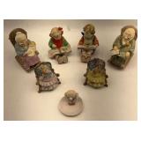 Collection of 7 Porcelain Figurines - Grandparents, Children, and Angels