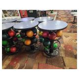 Round high-top metal base tables that hold...