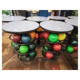 Round high-top metal base tables that hold...
