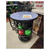 Round high-top metal base tables that hold...