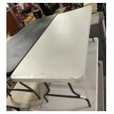 White Plastic Folding Table 29 x 71 inches.
