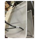 White Plastic Folding Table 29 x 71 Inches.