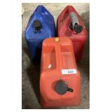 3 Plastic Gas Cans.