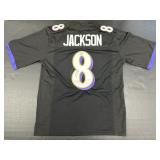 Autographed Lamar Jackson Jersey.