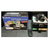 Fuji Film Camera, Captureview Binoculars, Phone.
