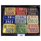 Vintage Metal & Cardboard Hunting Licenses.