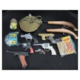Pellet Guns, Water Canteen, Caps.