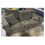 Clean, Cozy Olive Green Cozy Sofa.
