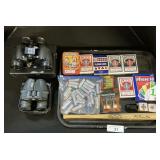 Bushnell Binoculars, Batteries, Playing Cards.