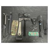 Hand Cuffs, Gerber Machete, Ax, Folding Shovel.