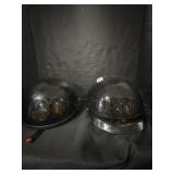 Pair of motorcycle helmets.