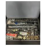 Metal hardware organizer box filled.