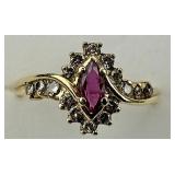 14KT Gold Ruby & Diamond Halo Ring.