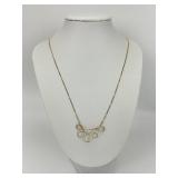 14KT Gold Filigree Pendant on 10K Chain.