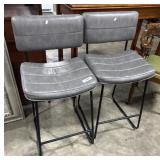 Mid Century Modern Saddle Style Stools.