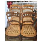 4 wooden cane bottom chairs.