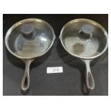 2 Lodge Cast Iron Pans W/ Lids.