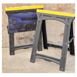 (2) Folding Plastic Saw Horses, 1 has a tool pouch
